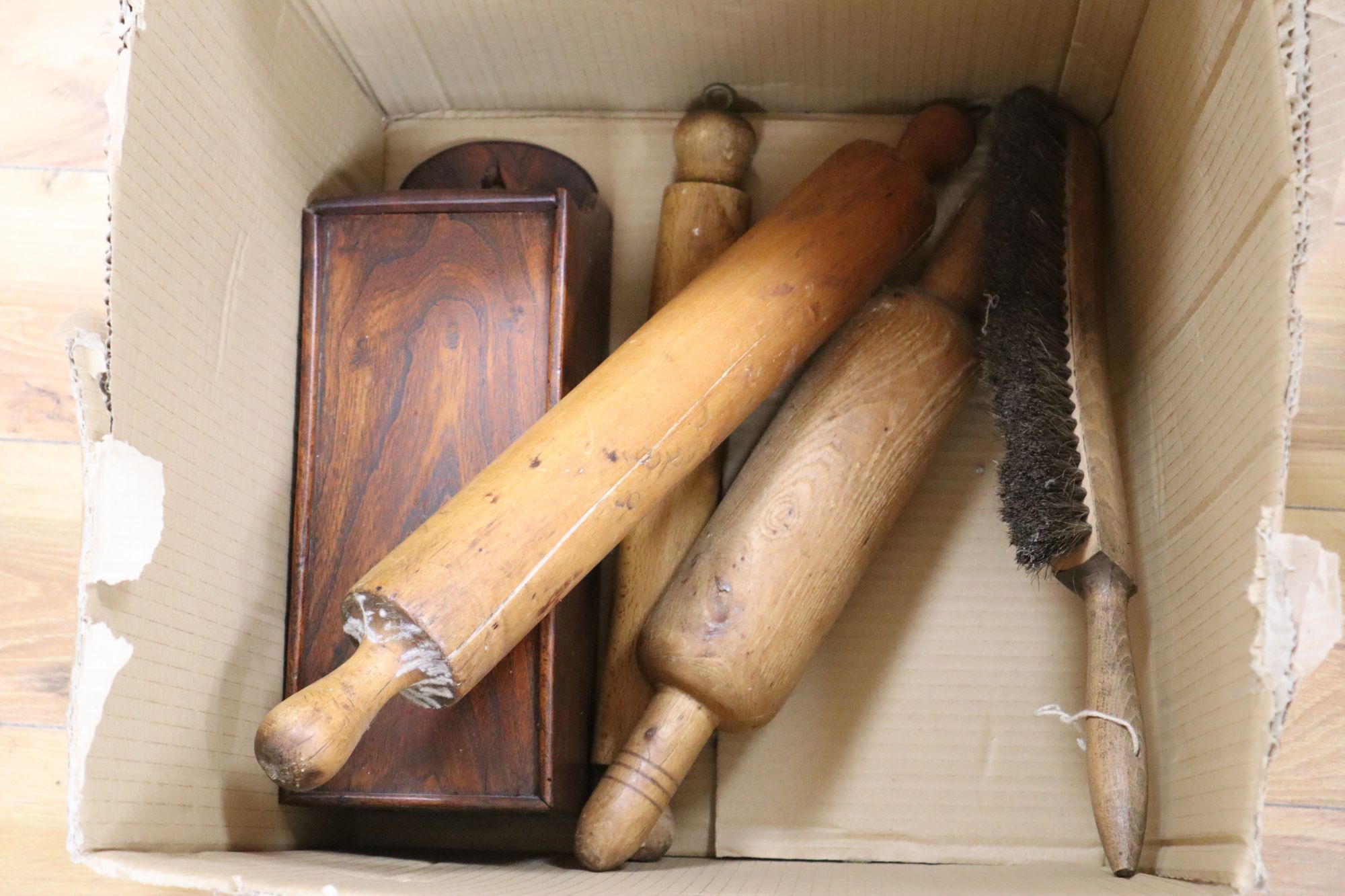 A large quantity of 19th/20th century treen, including an elm candlebox, bread boards, a child's chair, spoons etc.